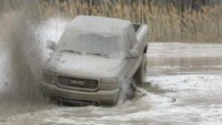 GMC Truck Battles In The Mud Pit